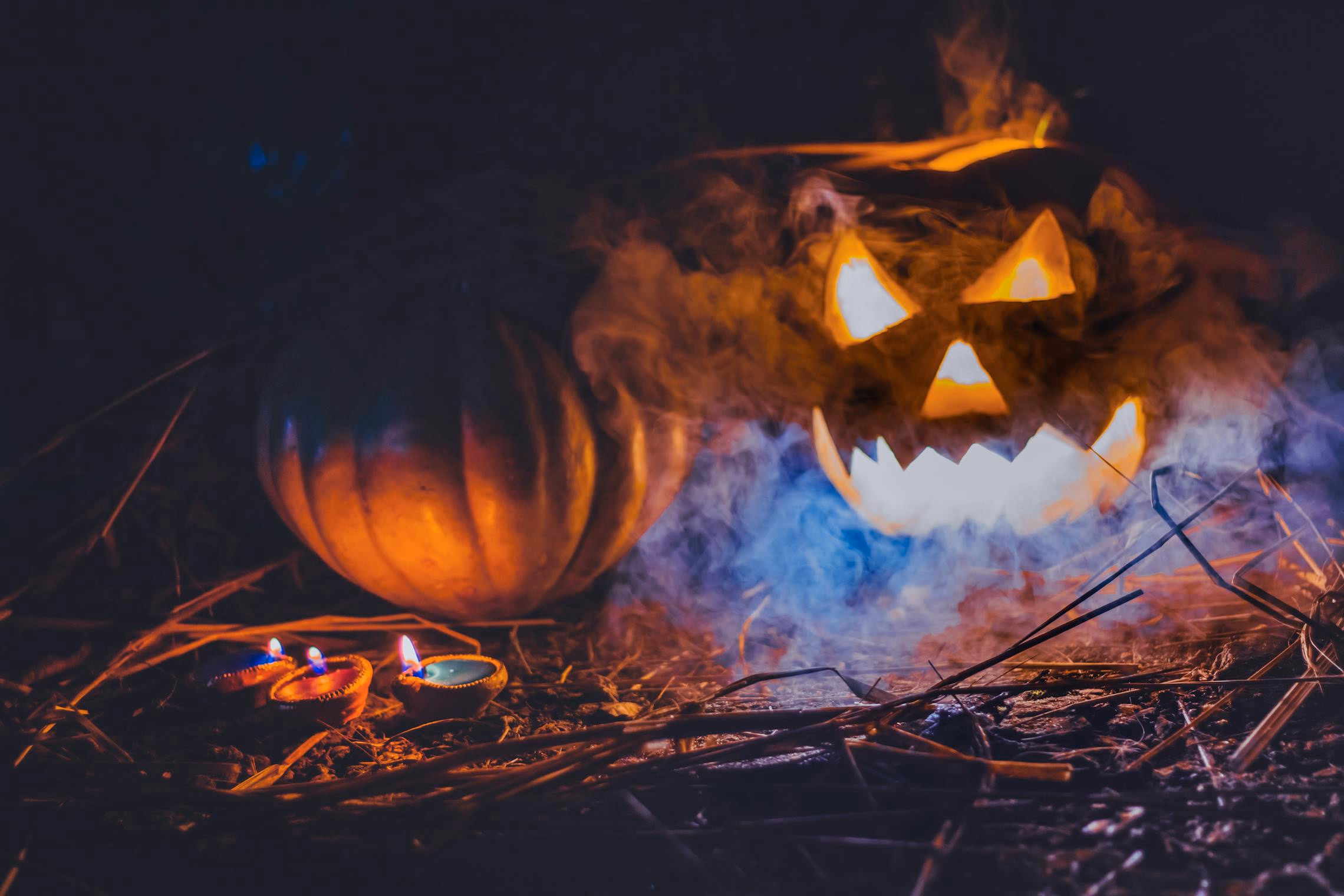 Low-lying fog crawling across a dark floor with purple backlighting