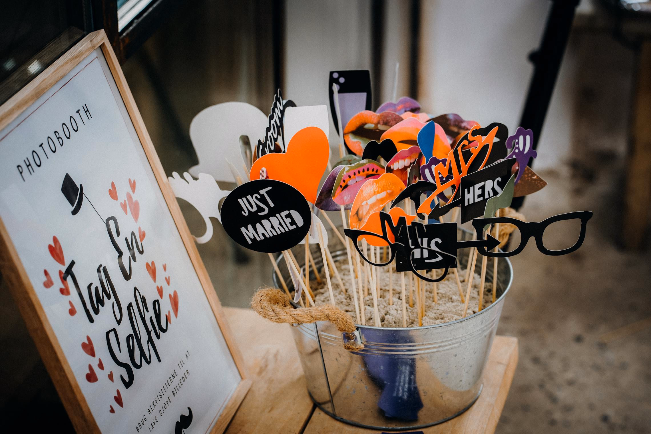 Six Halloween photo booth prop signs displayed against a dark backdrop